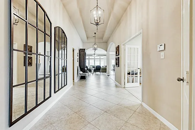 a view of a hallway with furniture