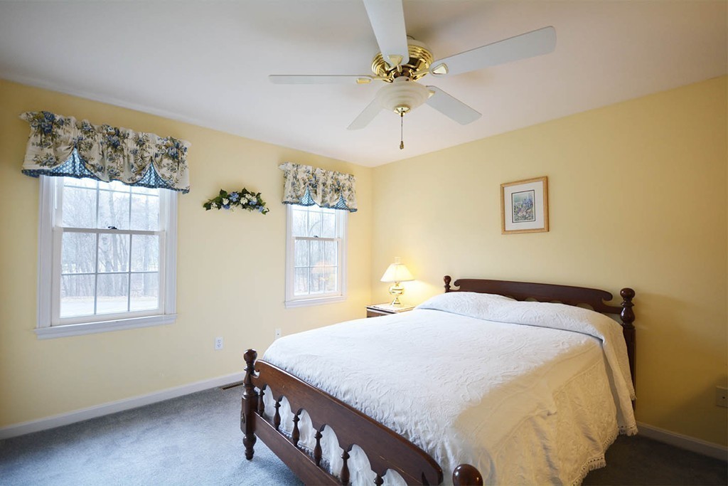 5 Ridge Road Pepperell, MA 01463 - Photo 15 of 25 a bedroom with a bed and a window