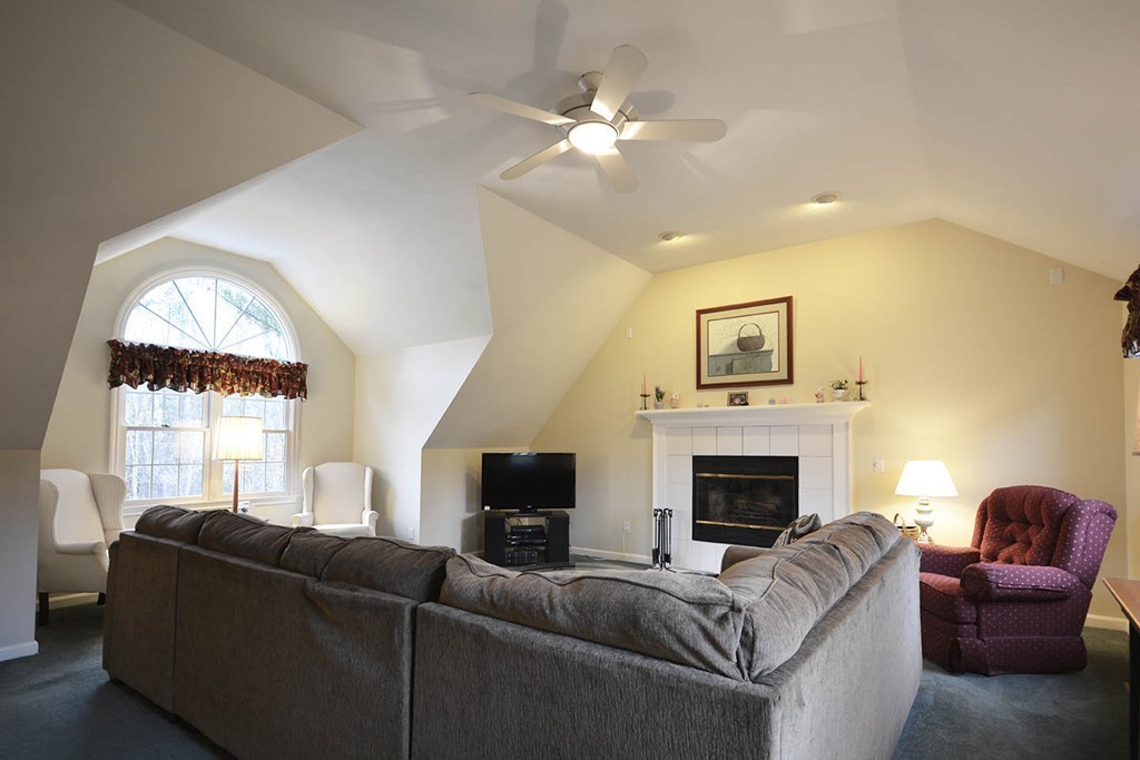 5 Ridge Road Pepperell, MA 01463 - Photo 6 of 25 a living room with furniture a fireplace and a large window