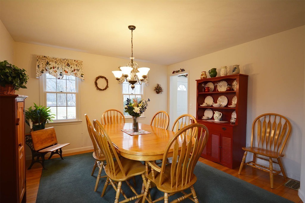 5 Ridge Road Pepperell, MA 01463 - Photo 9 of 25 a view of a dining room with furniture and chandelier