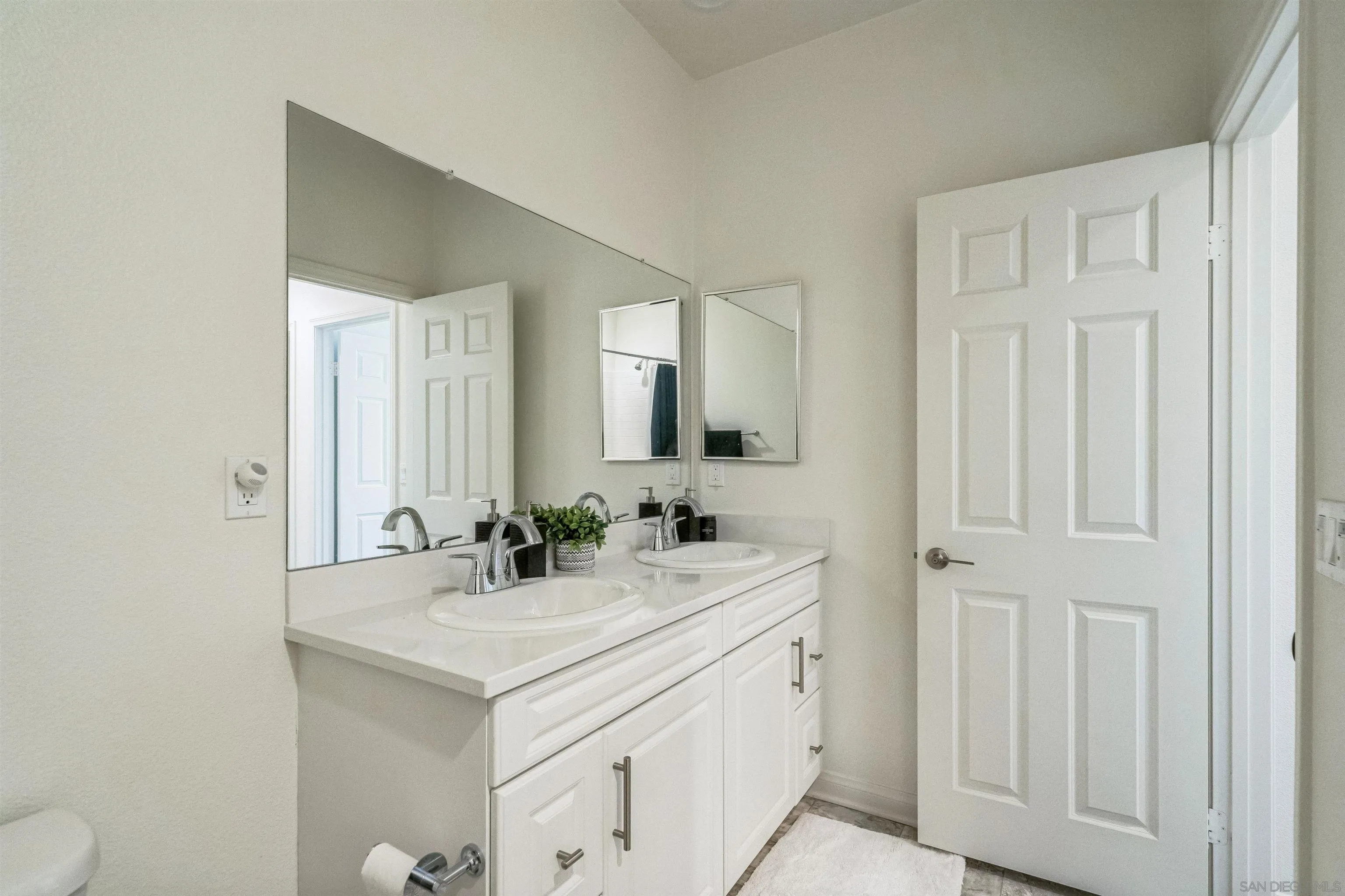 2018 Barite Street Spring Valley, CA 91977 - Photo 21 of 47 a bathroom with a sink and a mirror