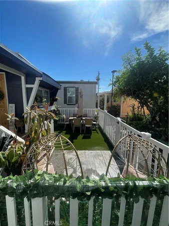 a view of balcony with deck and outdoor seating