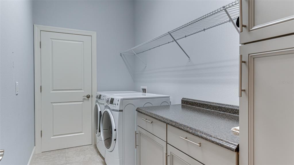 4511 Terrazza Court Lakewood Ranch, FL 34211 - Photo 14 of 65 a utility room with dryer and washer