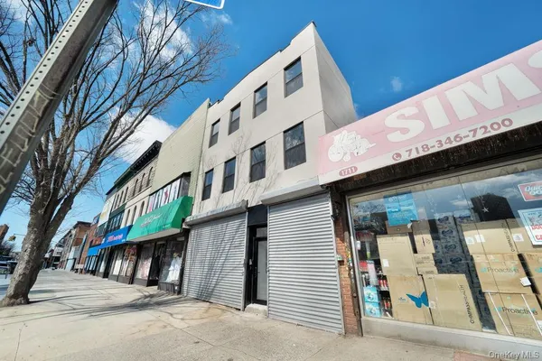 a front view of a building with retail shops