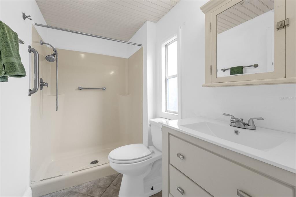 562 Ruth Circle Melbourne, FL 32904 - Photo 11 of 21 a bathroom with a sink a toilet and shower