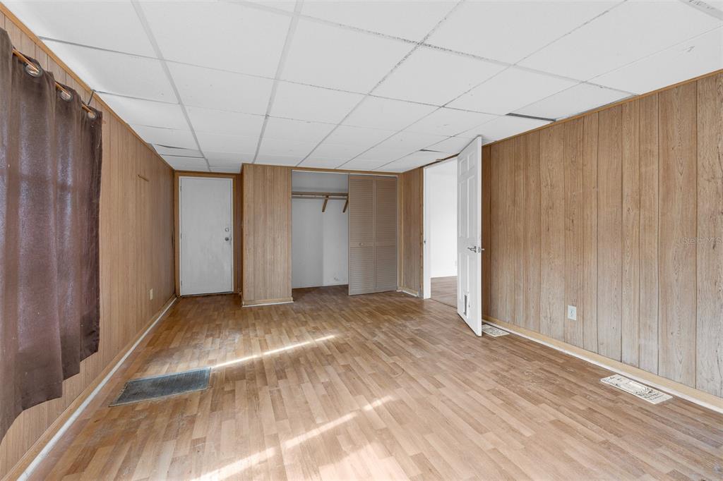 562 Ruth Circle Melbourne, FL 32904 - Photo 14 of 21 a view of empty room with wooden floor