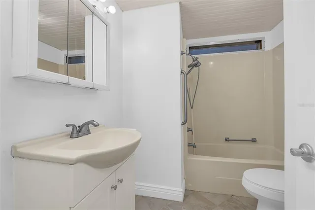 a bathroom with a sink toilet and a bathtub