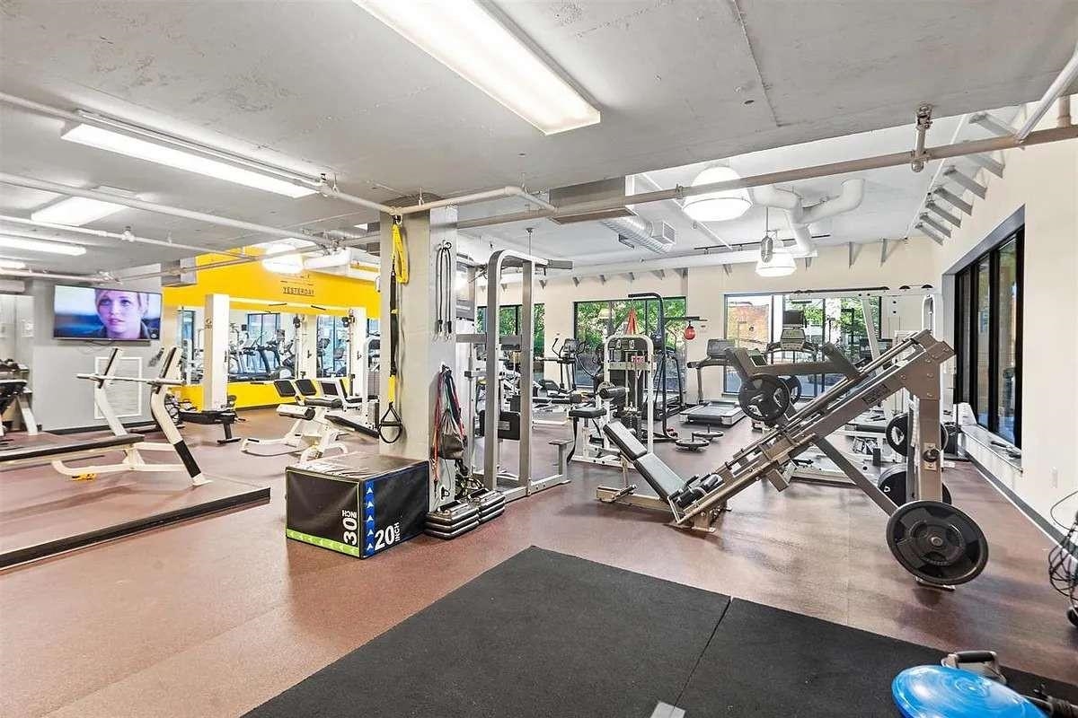 700 Grove Street, Unit 12F Jersey City, NJ 07310 - Photo 26 of 27 a view of a room with gym equipment