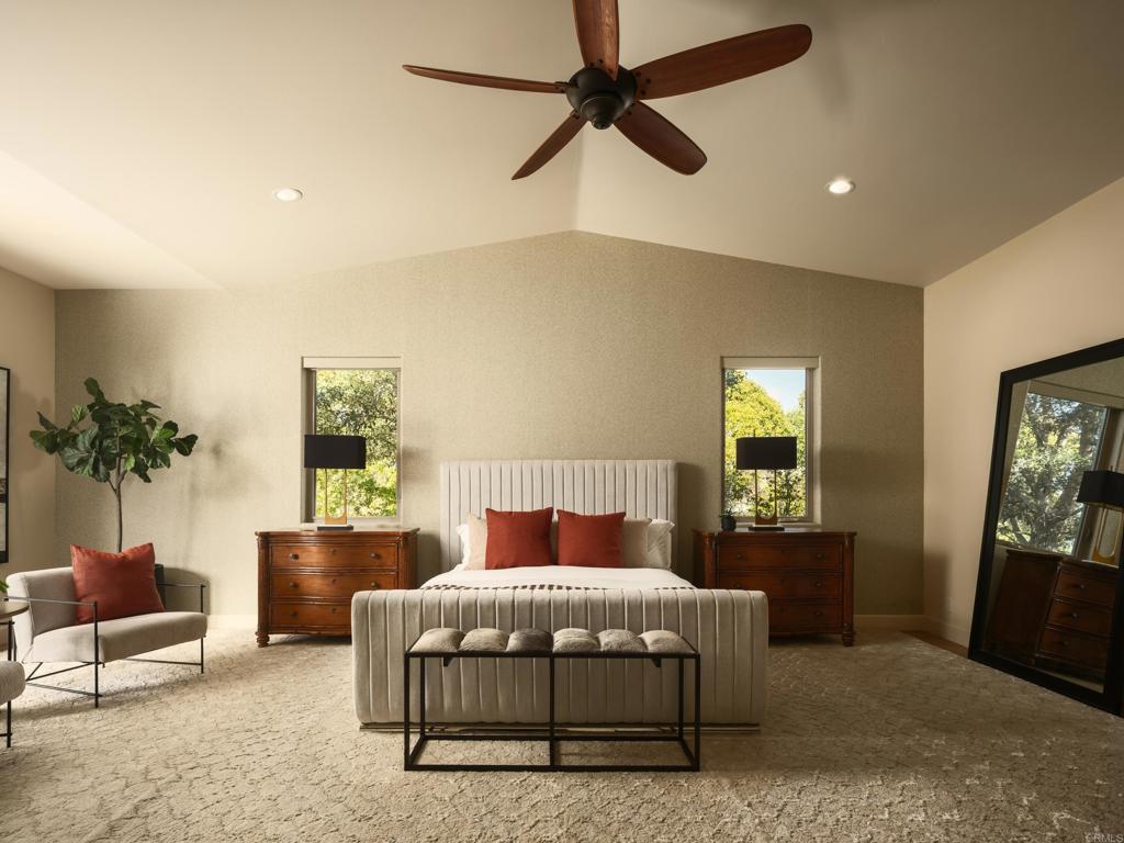 15731 Via De Santa Fe Rancho Santa Fe, CA 92067 - Photo 11 of 39 a bedroom with a bed a couch and potted plant