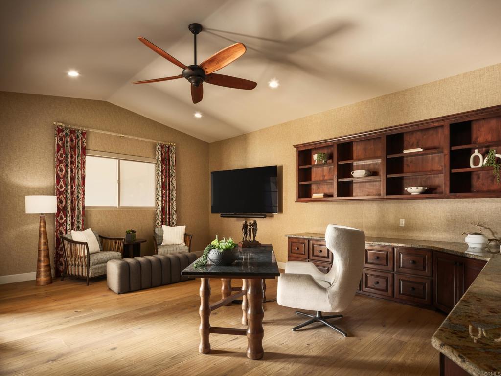 15731 Via De Santa Fe Rancho Santa Fe, CA 92067 - Photo 14 of 39 a living room with furniture and a flat screen tv