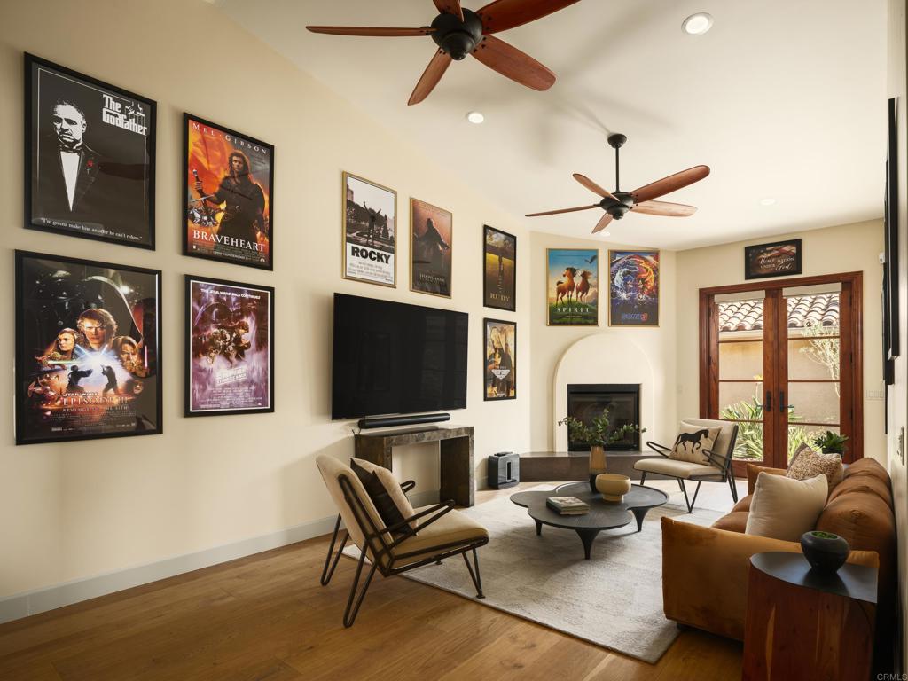 15731 Via De Santa Fe Rancho Santa Fe, CA 92067 - Photo 15 of 39 a living room with fireplace furniture and a flat screen tv