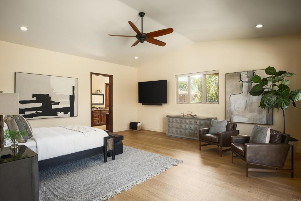 15731 Via De Santa Fe Rancho Santa Fe, CA 92067 - Photo 17 of 39 a living room with furniture and a flat screen tv