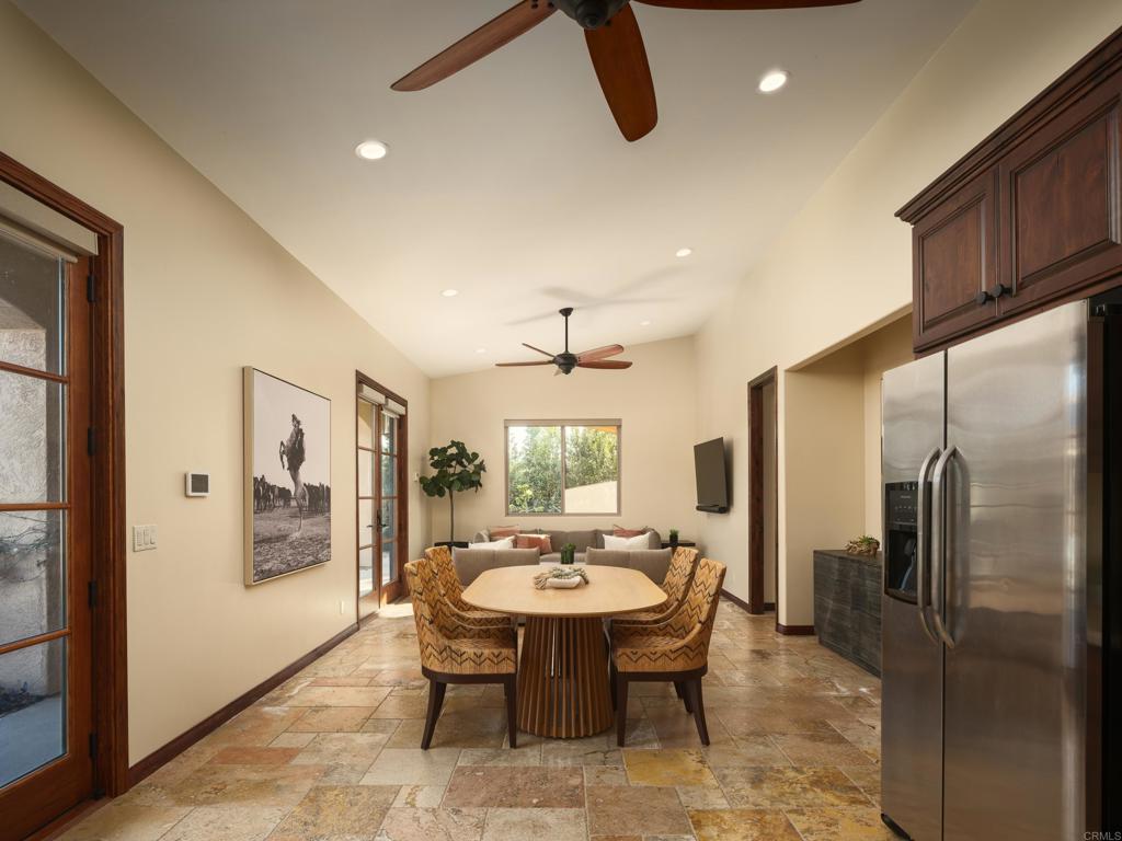15731 Via De Santa Fe Rancho Santa Fe, CA 92067 - Photo 21 of 39 a view of a dining room with furniture window and wooden floor