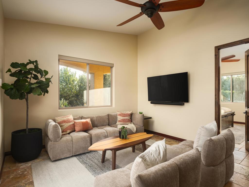 15731 Via De Santa Fe Rancho Santa Fe, CA 92067 - Photo 22 of 39 a living room with furniture and a flat screen tv