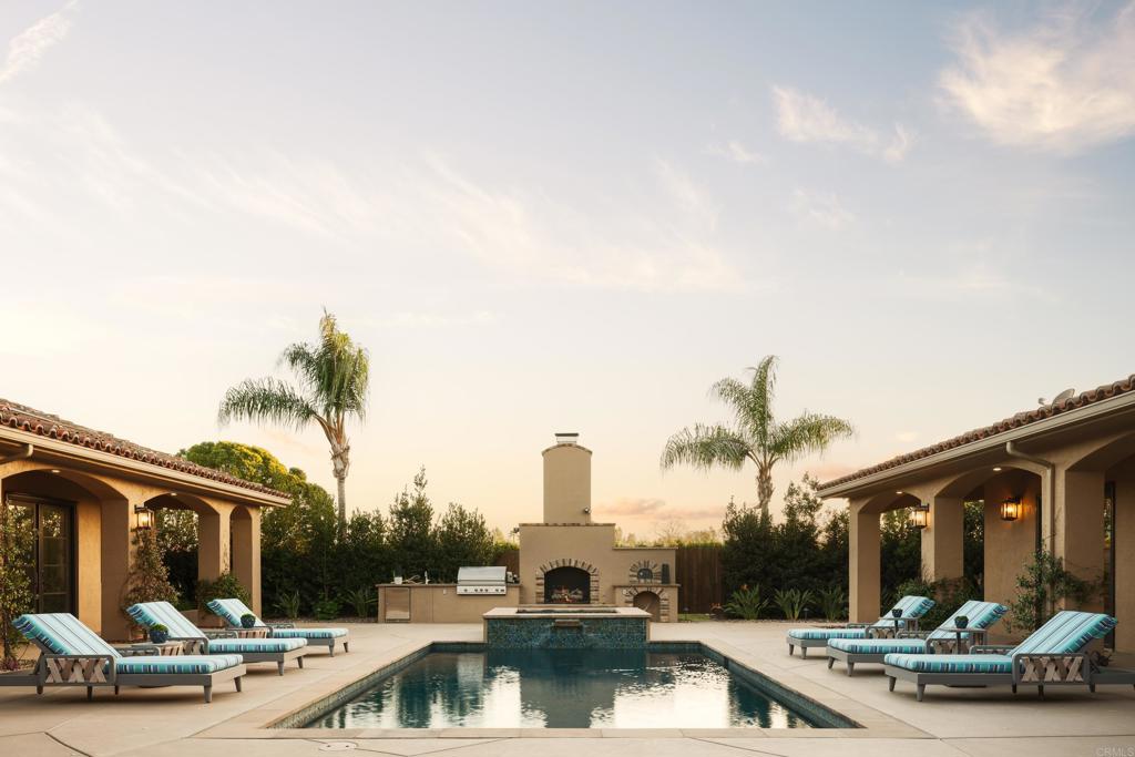 15731 Via De Santa Fe Rancho Santa Fe, CA 92067 - Photo 24 of 39 a view of a house with swimming pool and furniture