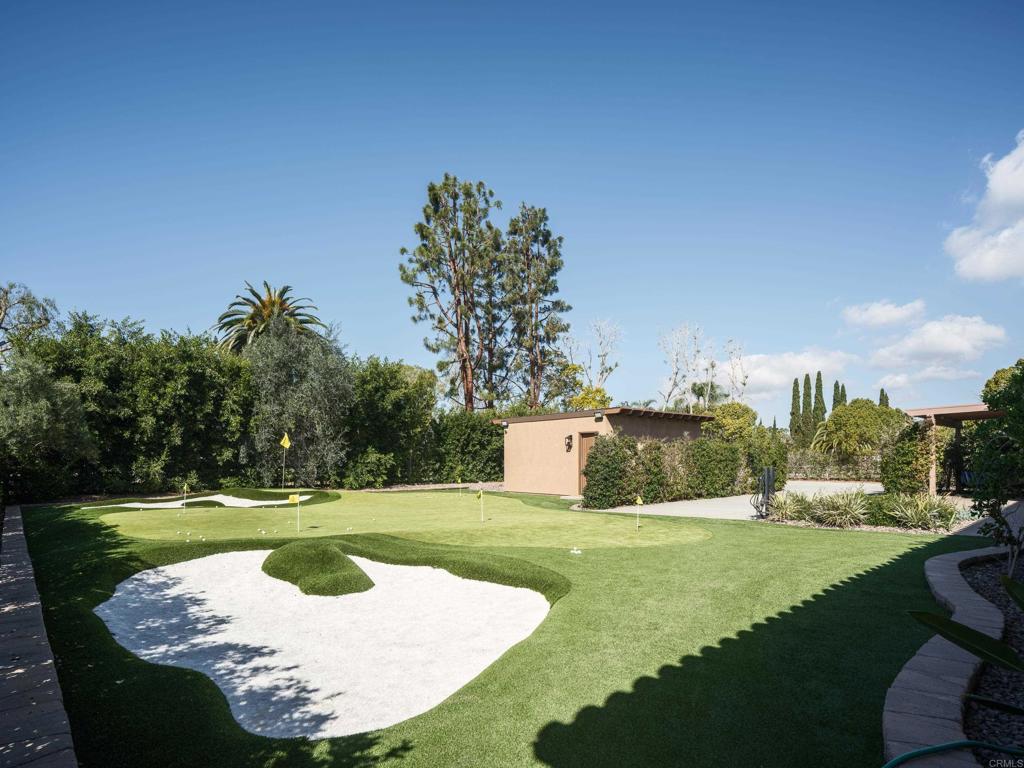 15731 Via De Santa Fe Rancho Santa Fe, CA 92067 - Photo 27 of 39 a view of a swimming pool with a yard