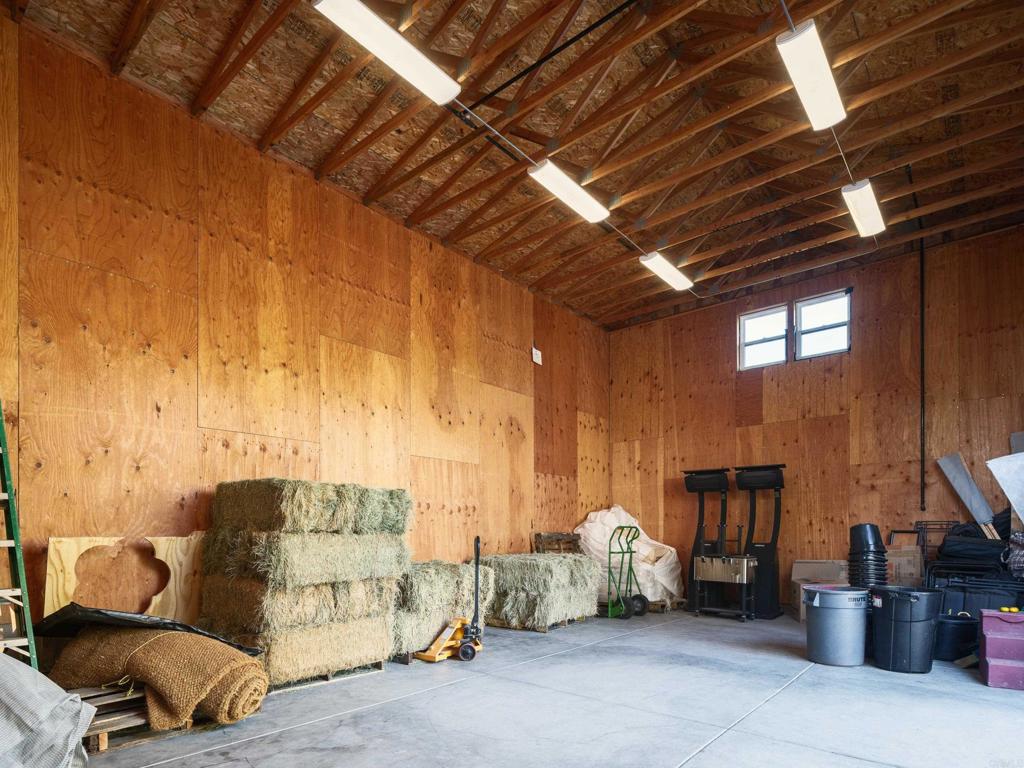 15731 Via De Santa Fe Rancho Santa Fe, CA 92067 - Photo 37 of 39 a living room with furniture and a fireplace