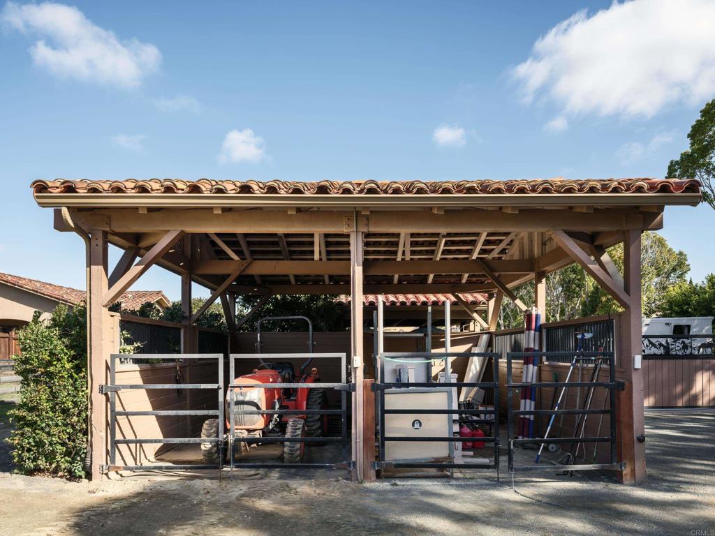 15731 Via De Santa Fe Rancho Santa Fe, CA 92067 - Photo 38 of 39 a view of a chair and table in the patio