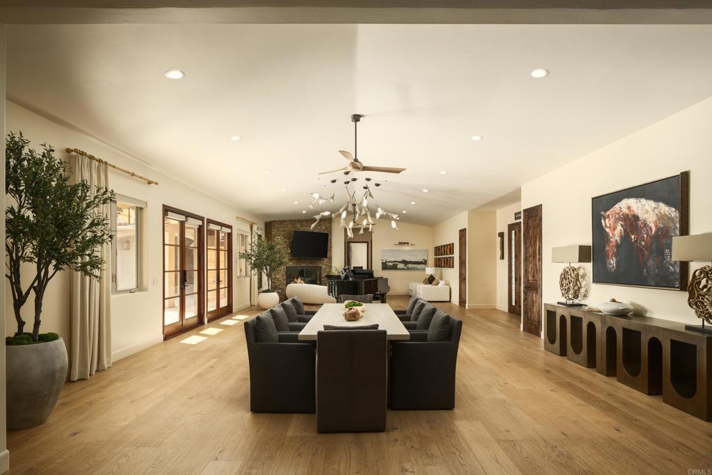 15731 Via De Santa Fe Rancho Santa Fe, CA 92067 - Photo 6 of 39 a living room with furniture and a chandelier