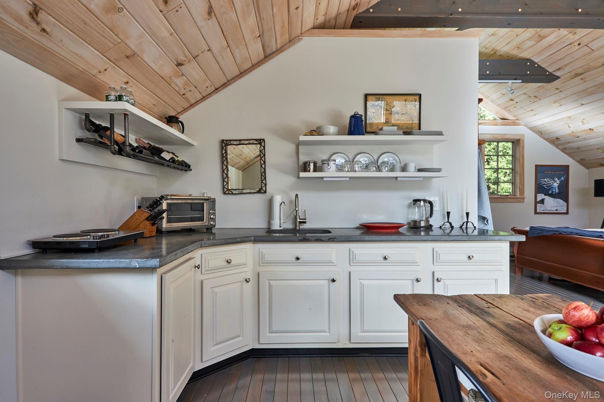 1681 Platte Clove Road Hunter, NY 12427 - Photo 12 of 23 a kitchen with cabinets and wooden floor