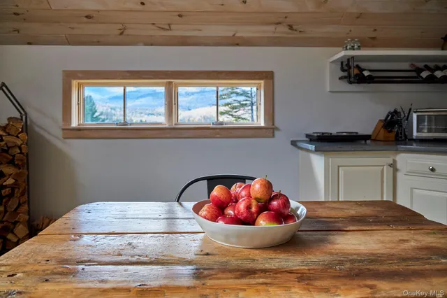 a view of a kitchen with a sink and cabinets