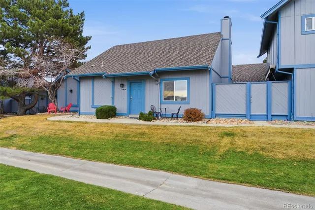 a swimming pool view with a seating space