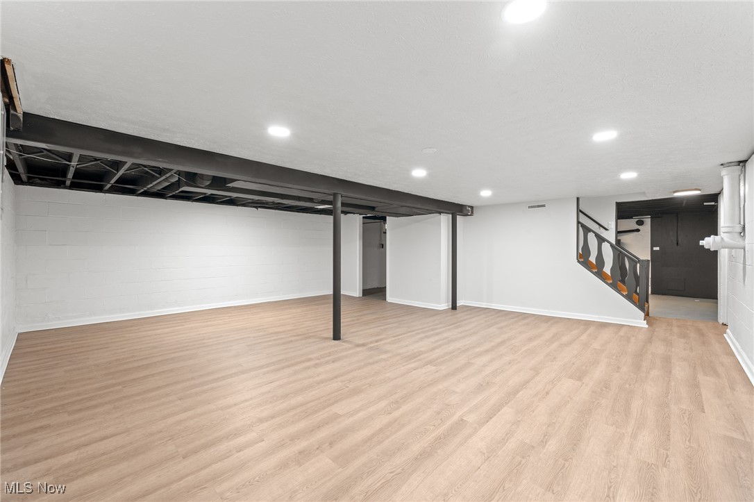 5266 Wilson Mills Road Cleveland, OH 44143 - Photo 35 of 50 Finished below grade area featuring stairs and light wood finished floors