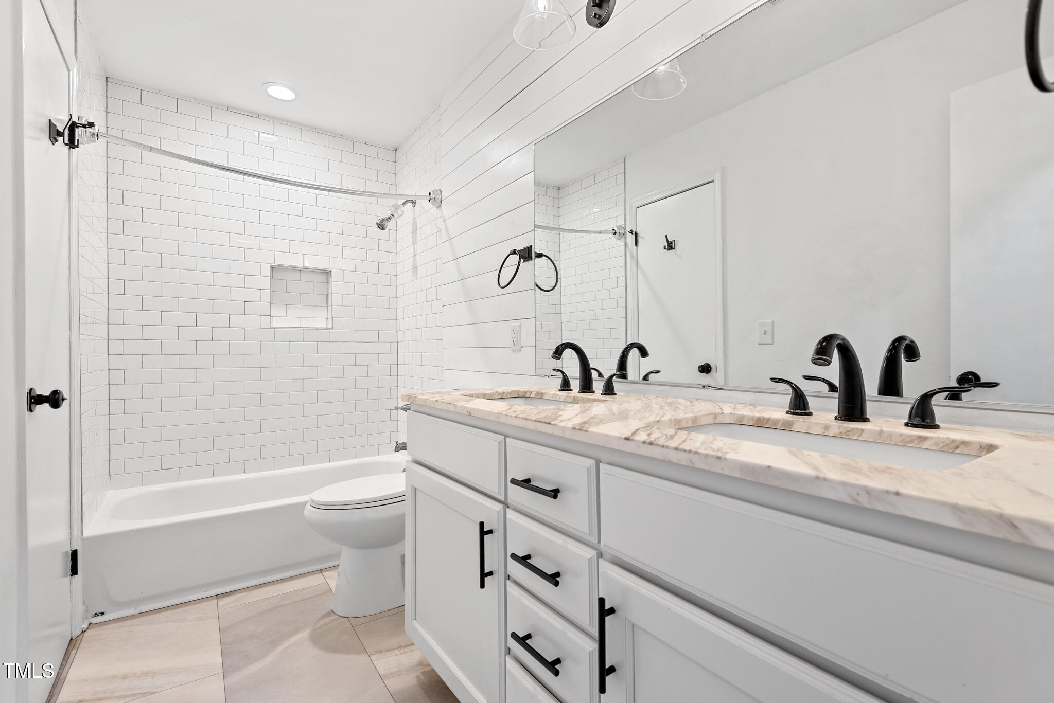 7309 Barberry Court Raleigh, NC 27615 - Photo 19 of 43 a bathroom with a granite countertop sink a toilet and a bathtub