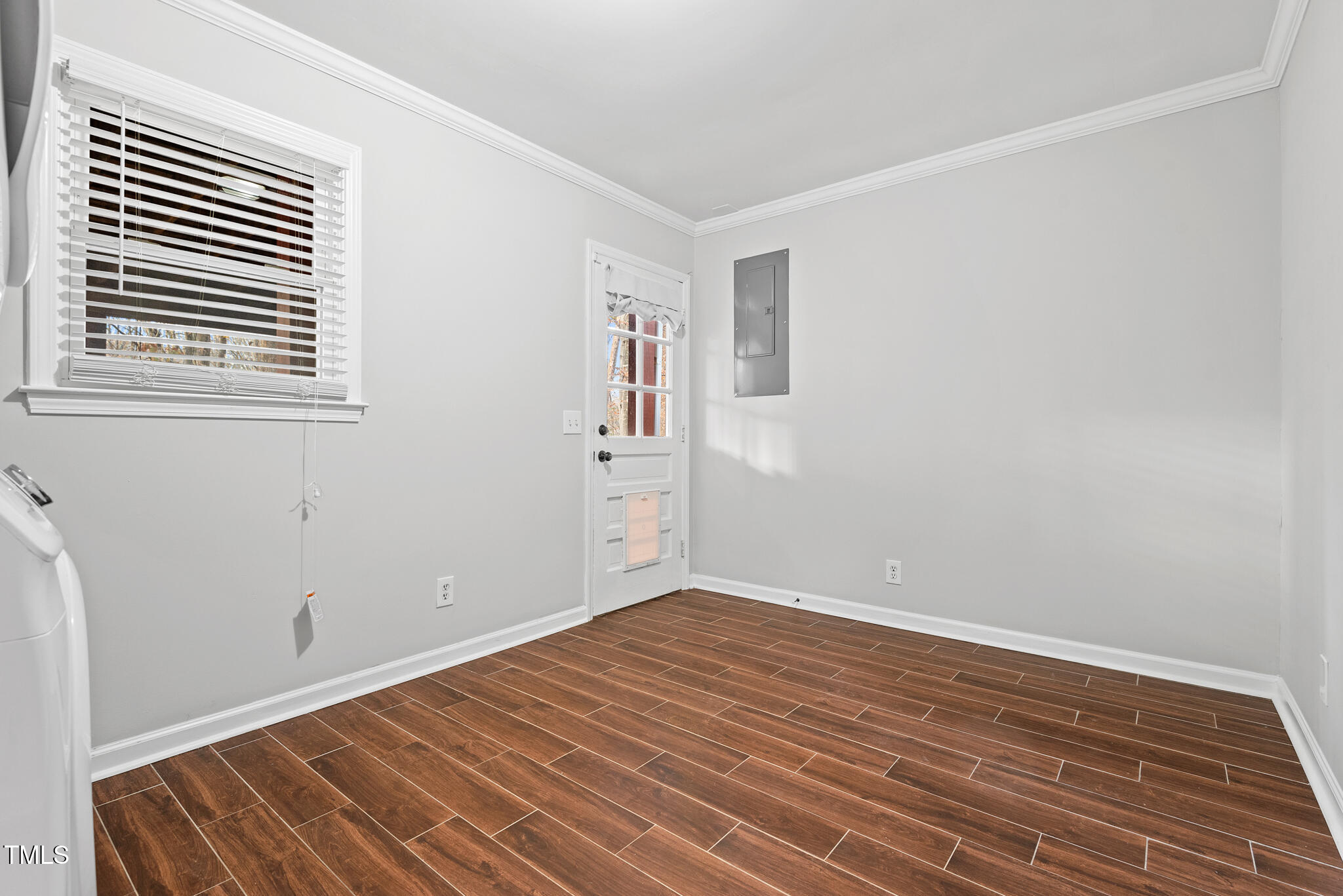 7309 Barberry Court Raleigh, NC 27615 - Photo 22 of 43 a view of empty room with wooden floor