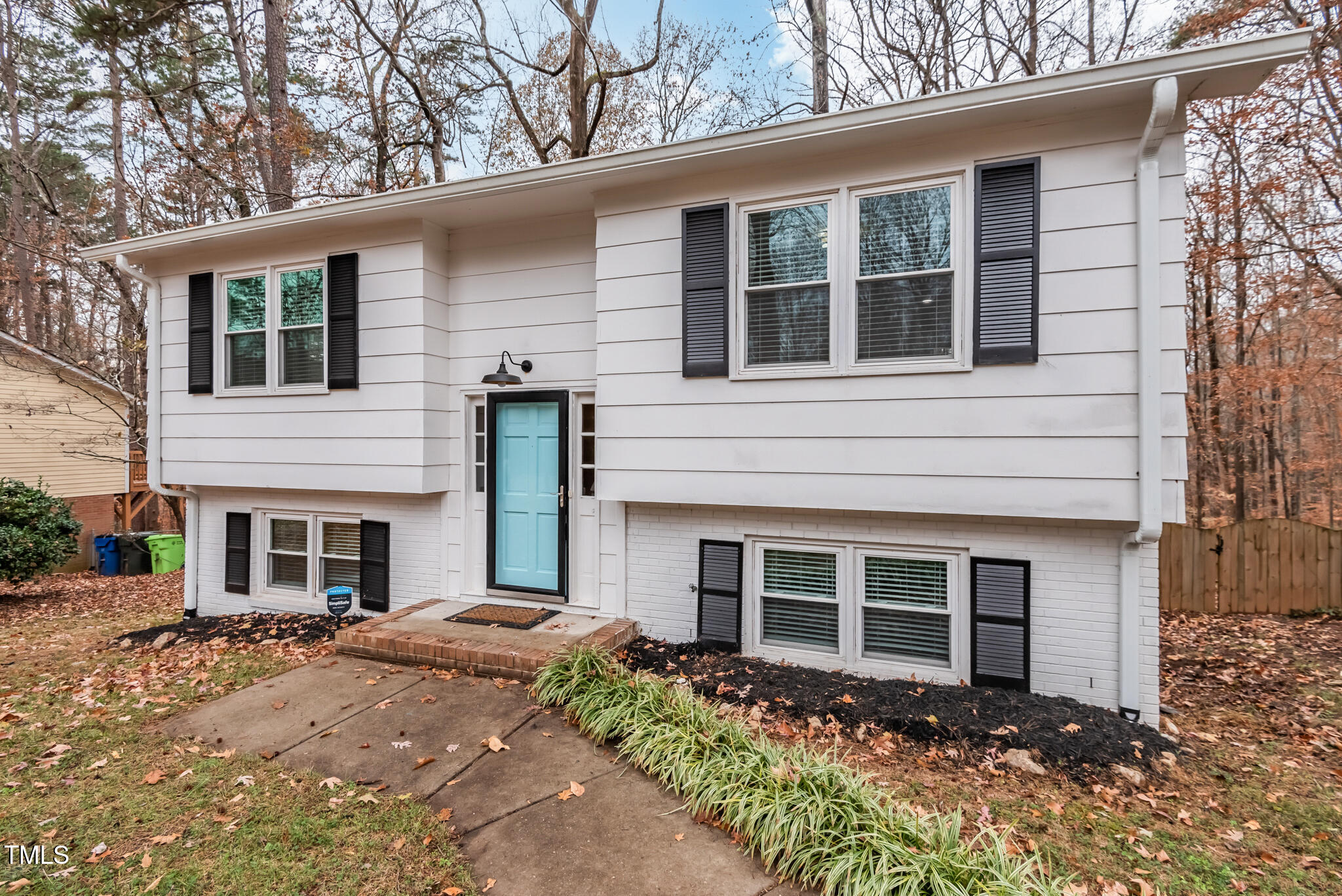 7309 Barberry Court Raleigh, NC 27615 - Photo 3 of 43 a front view of a house with garden