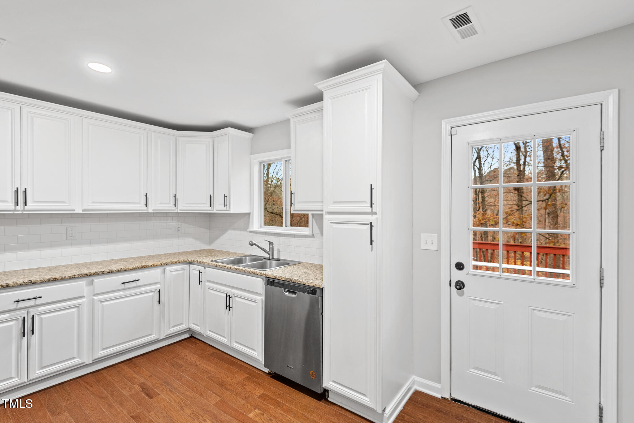 7309 Barberry Court Raleigh, NC 27615 - Photo 10 of 43 a kitchen with a sink cabinets and window