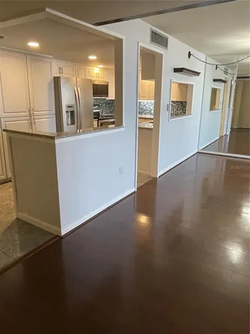 a view of a kitchen cabinets and a wooden floor