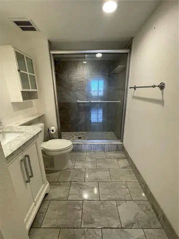 a bathroom with a sink and a shower