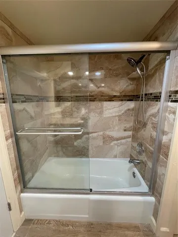 a bathroom with a bath tub