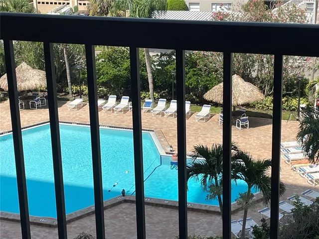 a view of swimming pool from a balcony