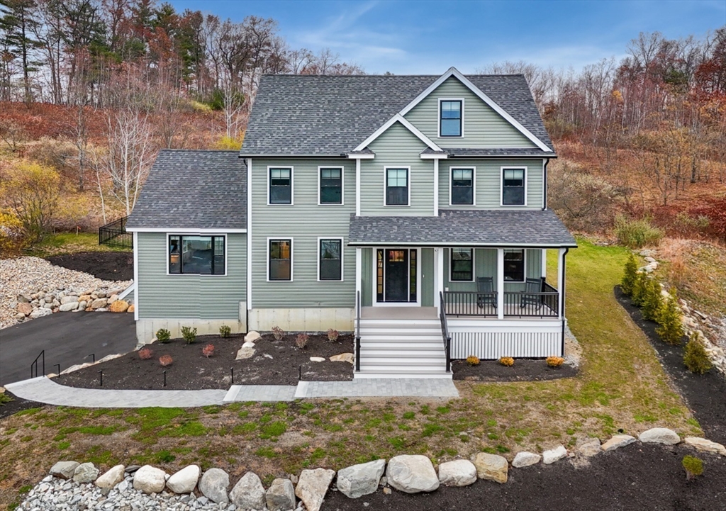 122 Seven Sister Road Haverhill, MA 01830 - Photo 1 of 33 a front view of a house with garden