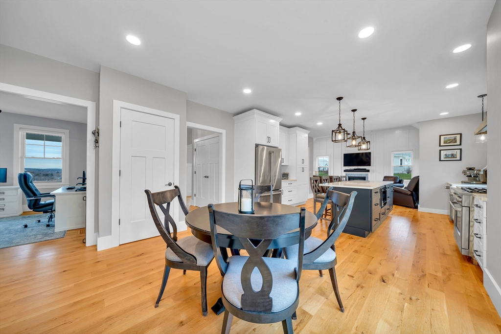 122 Seven Sister Road Haverhill, MA 01830 - Photo 11 of 33 a view of a dining room with furniture and wooden floor