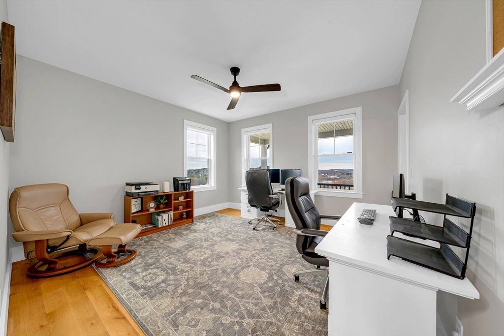 122 Seven Sister Road Haverhill, MA 01830 - Photo 12 of 33 a view of a workspace with furniture and a window
