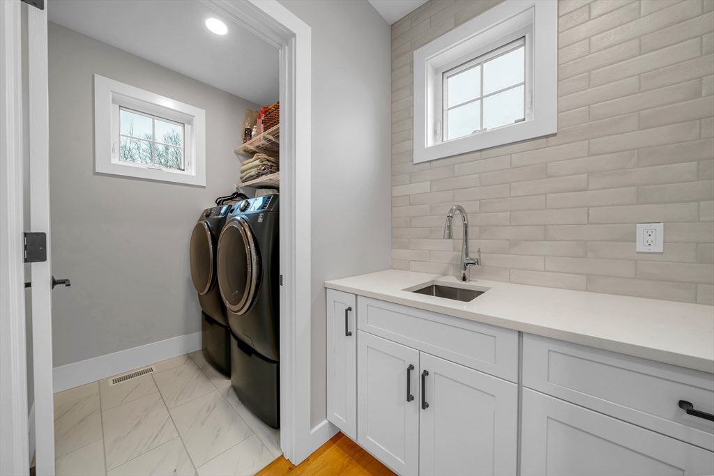 122 Seven Sister Road Haverhill, MA 01830 - Photo 14 of 33 a bathroom with a sink and mirror