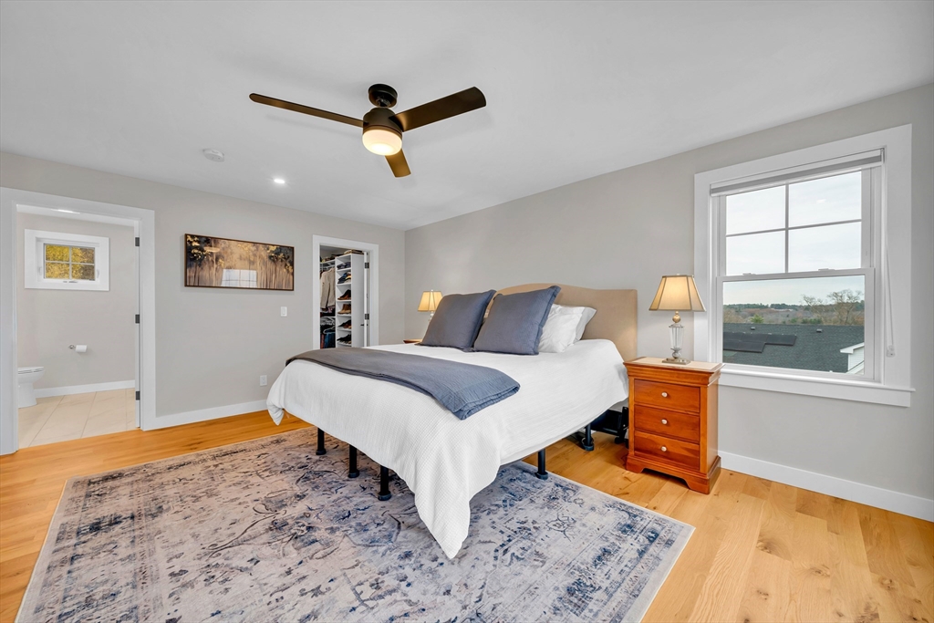 122 Seven Sister Road Haverhill, MA 01830 - Photo 17 of 33 a bedroom with a bed and wooden floor