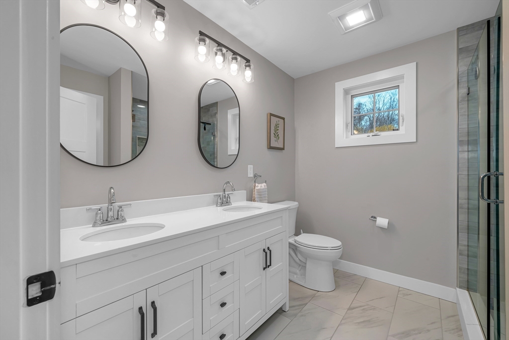 122 Seven Sister Road Haverhill, MA 01830 - Photo 18 of 33 a bathroom with 2 sink and a mirror