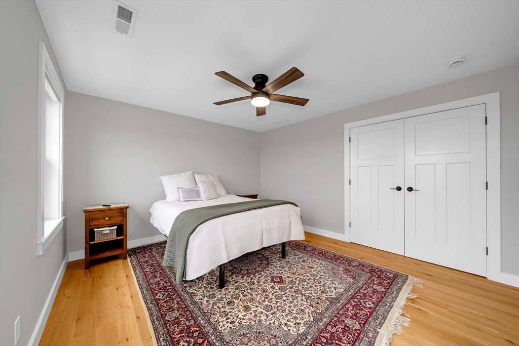 122 Seven Sister Road Haverhill, MA 01830 - Photo 20 of 33 a bed sitting in a bedroom next to a window