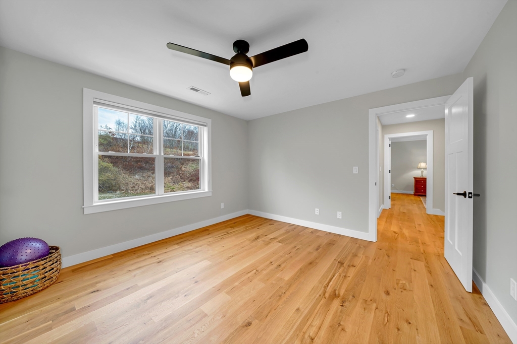 122 Seven Sister Road Haverhill, MA 01830 - Photo 21 of 33 wooden floor in an empty room with a window