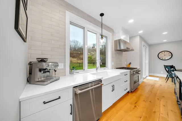 a kitchen with sink cabinets and window