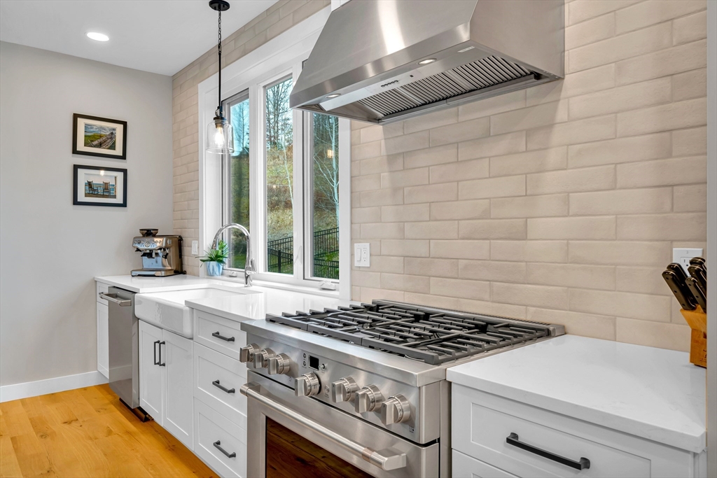122 Seven Sister Road Haverhill, MA 01830 - Photo 7 of 33 a stove top oven sitting inside of a kitchen