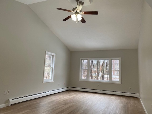 141 East County Road, Unit 141 Rutland, MA 01543 - Photo 8 of 27 a view of an empty room with wooden floor and a window