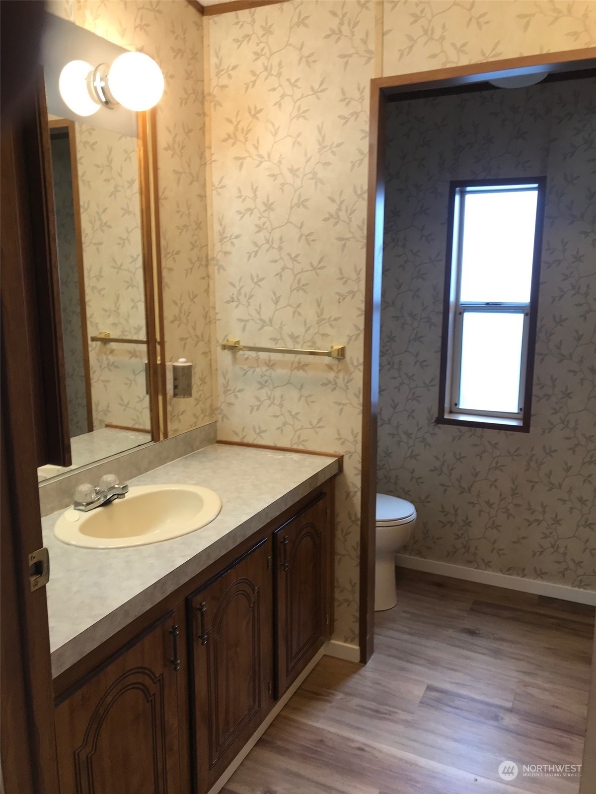 600 Northeast Lincoln Road, Unit 30 Poulsbo, WA 98370 - Photo 13 of 14 a bathroom with a granite countertop sink toilet and mirror