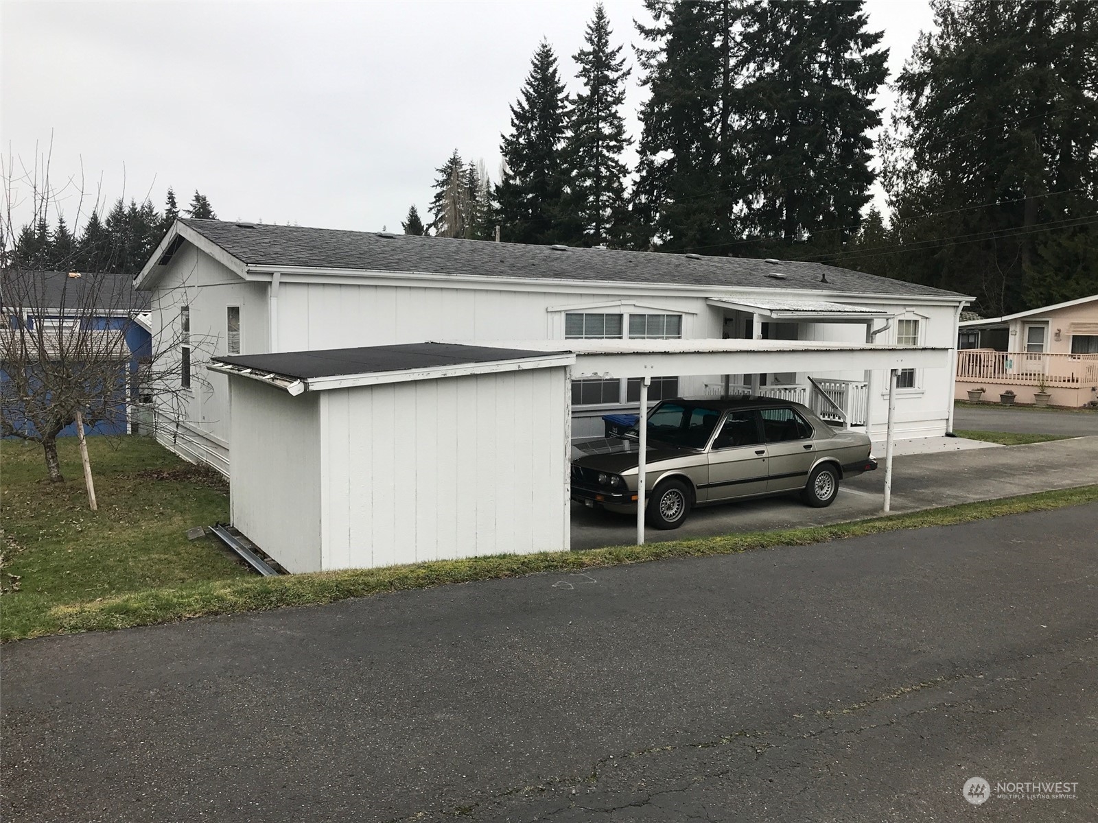 600 Northeast Lincoln Road, Unit 30 Poulsbo, WA 98370 - Photo 14 of 14 a view of a white house with a outdoor space