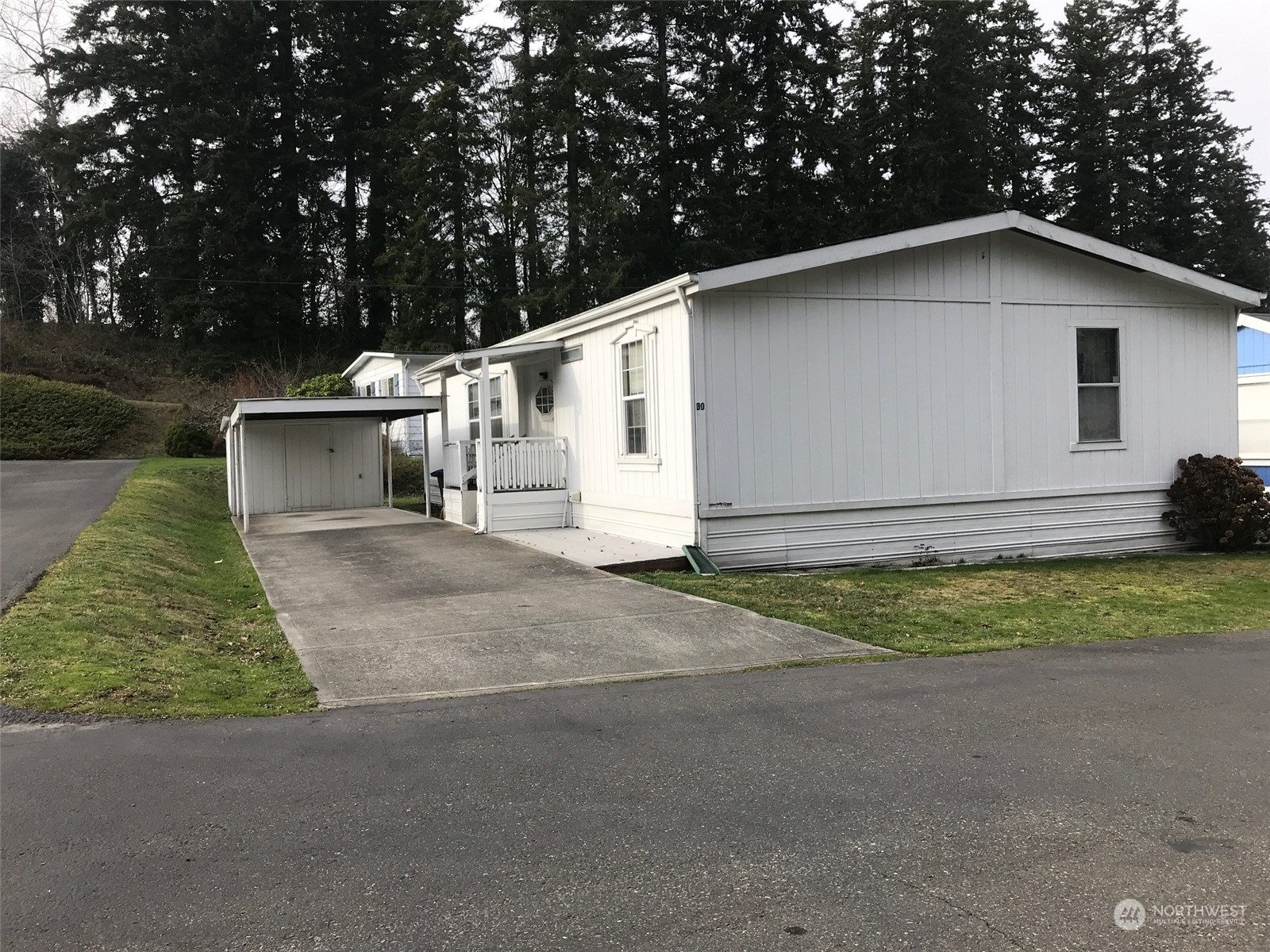 600 Northeast Lincoln Road, Unit 30 Poulsbo, WA 98370 - Photo 3 of 14 a view of house with backyard and garden