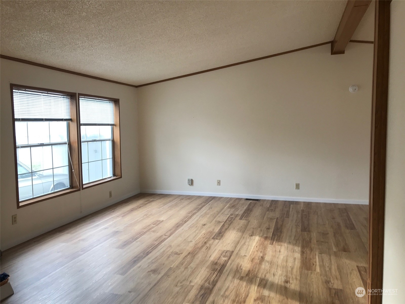 600 Northeast Lincoln Road, Unit 30 Poulsbo, WA 98370 - Photo 4 of 14 wooden floor in an empty room with a window
